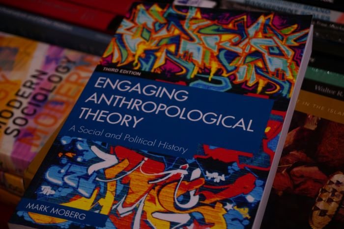 An anthropological science theory book placed on a table with other books