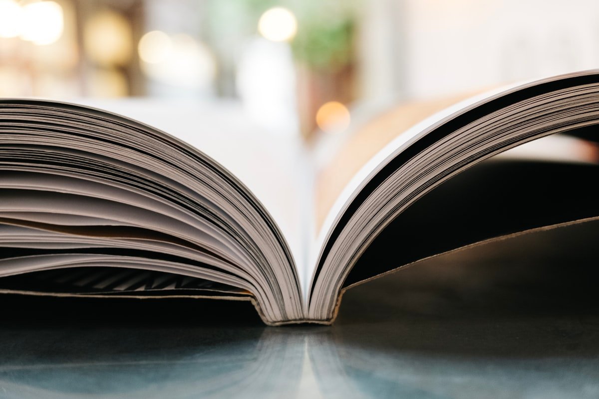 Open book photographed with soft bokeh lighting