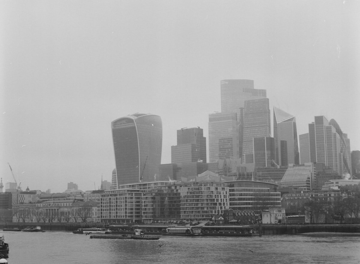 Modern city skyline with a river and boats