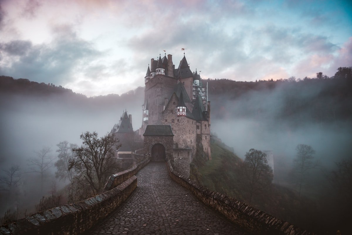 Misty medieval castle in fog