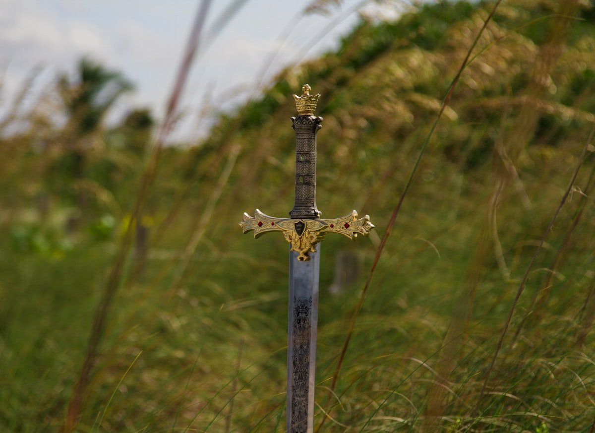 Best Dark Fantasy Books to Read in 2026: Grimdark to Gothic 2 A gray steel sword resting on the ground