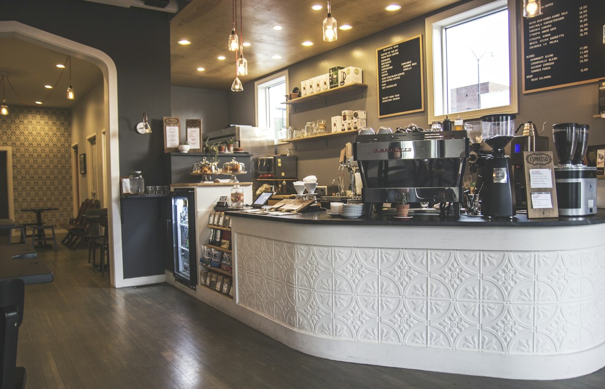 A coffee shop interior with espresso machines