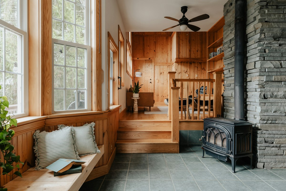 A cozy living room with a fireplace and warm furniture